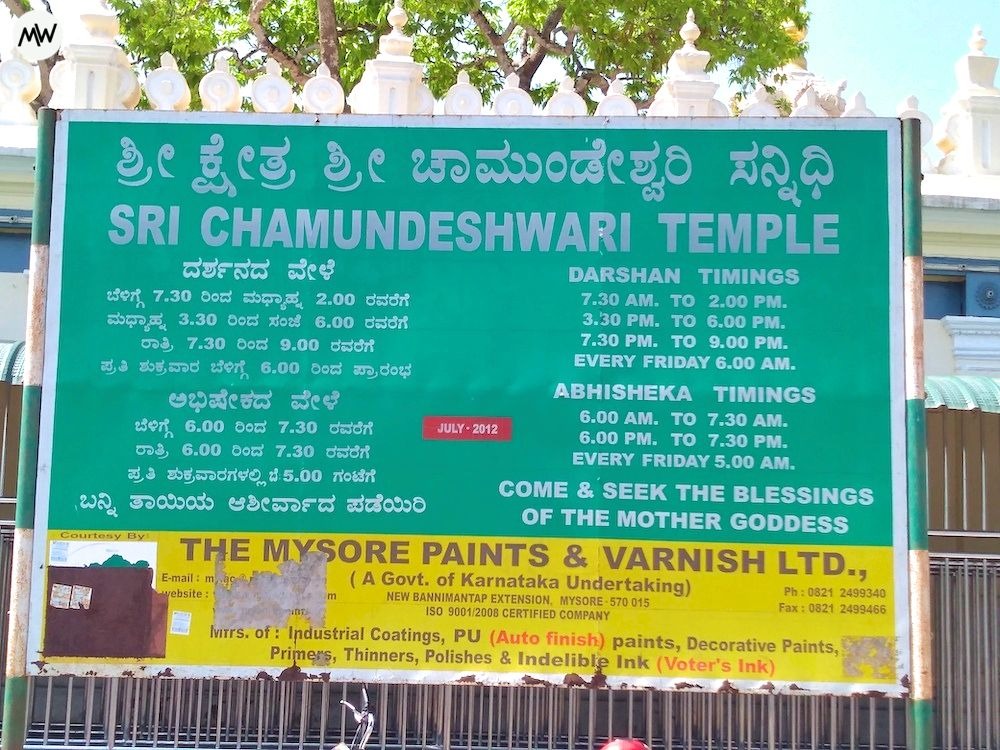 An information board showing visiting hours, installed at Chamundeshwari Temple Mysore