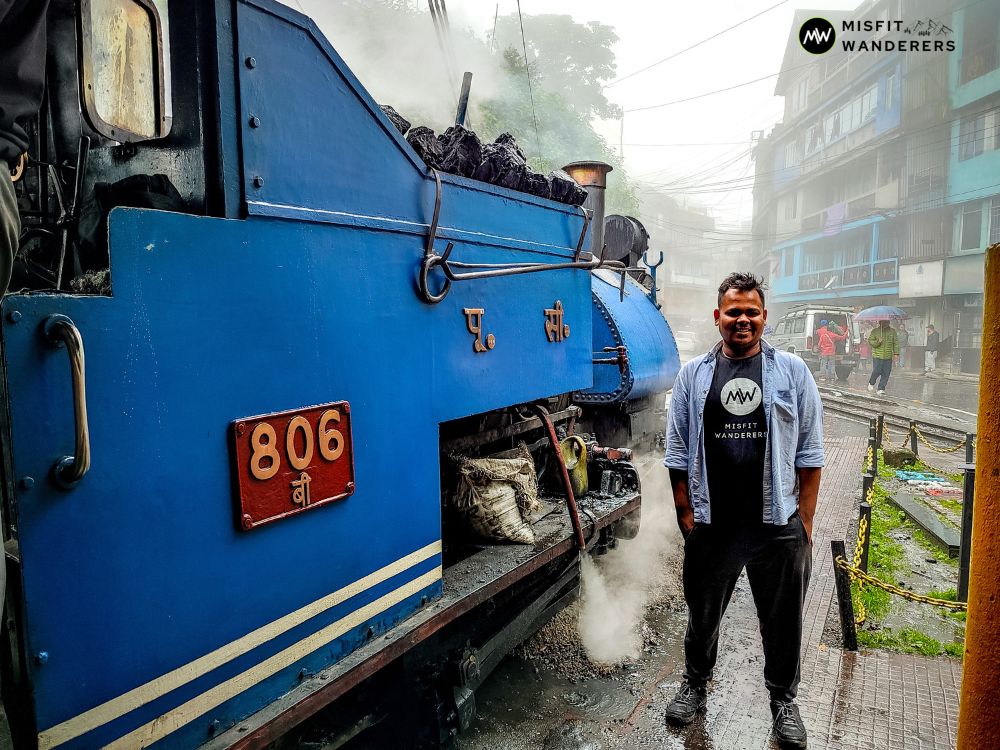 Vipin beside the steam engine of Darjeeling Himalayan Railway