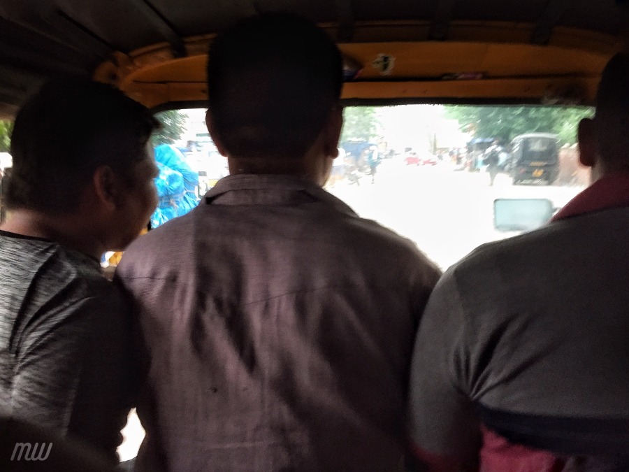 An autorickshaw, snapped by a passenger sitting just behind the driver.