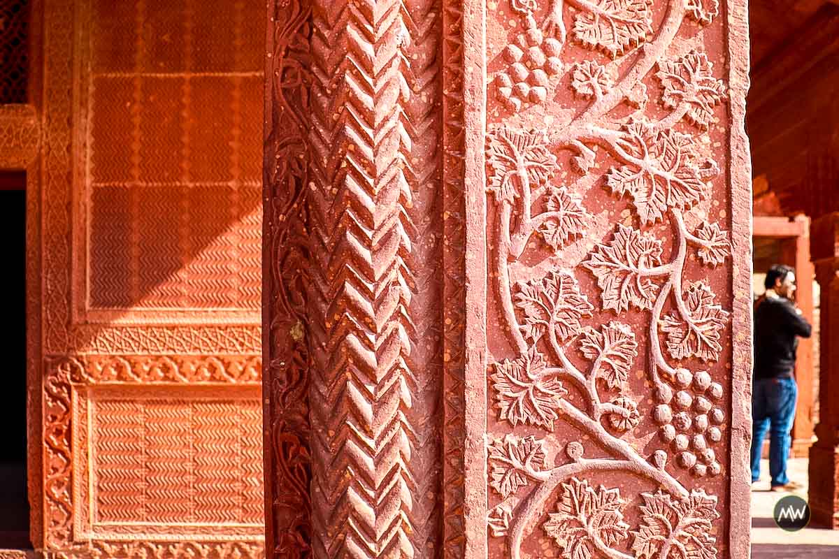 A beautiful carving on a column inside girls school at Fatehpur Sikri